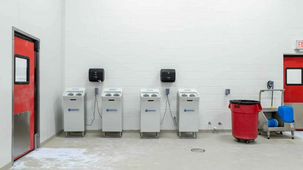 Alpine Slicing & Cheese Conversion - Hand and boot washers with boot sanitizing powder on floor
