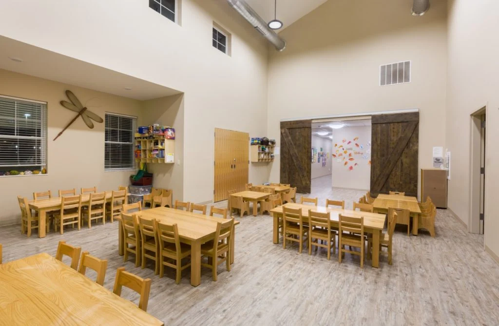 Academy of Little Vikings multi-purpose room with sliding barn doors