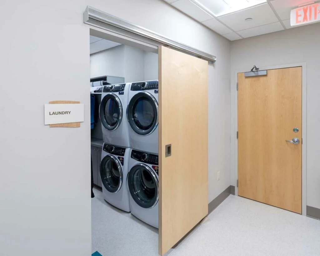 Dental Health Associates laundry area with sliding door