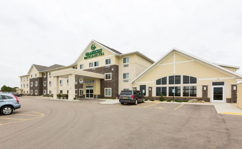 GrandStay Hotel & Suites Front view with welcoming front entry