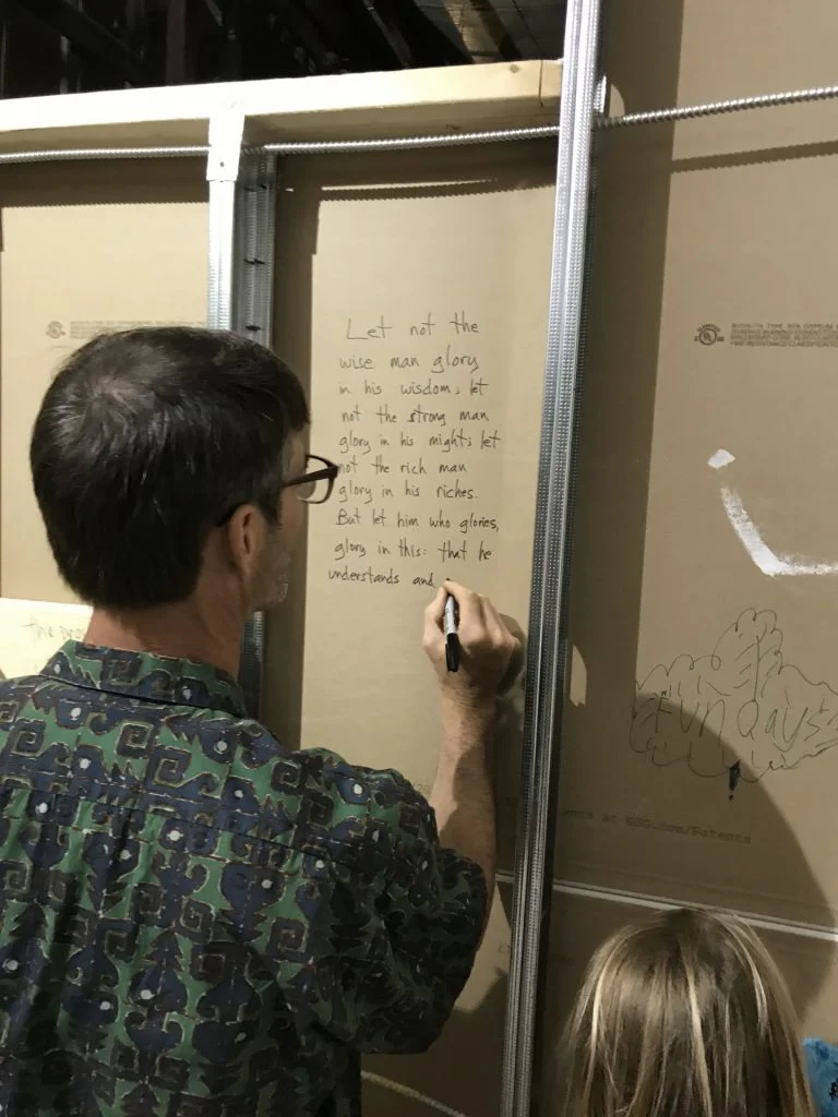 Lighthouse Church & Christian School - Writing blessings on the unfinished walls