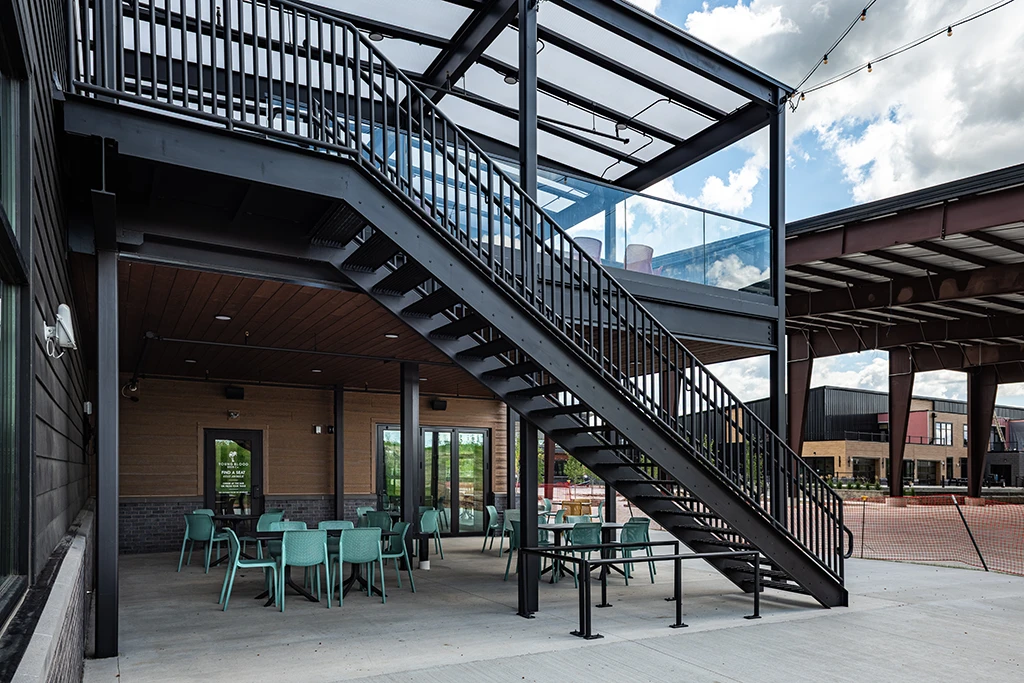 Dark gray staircase to outdoor dining area