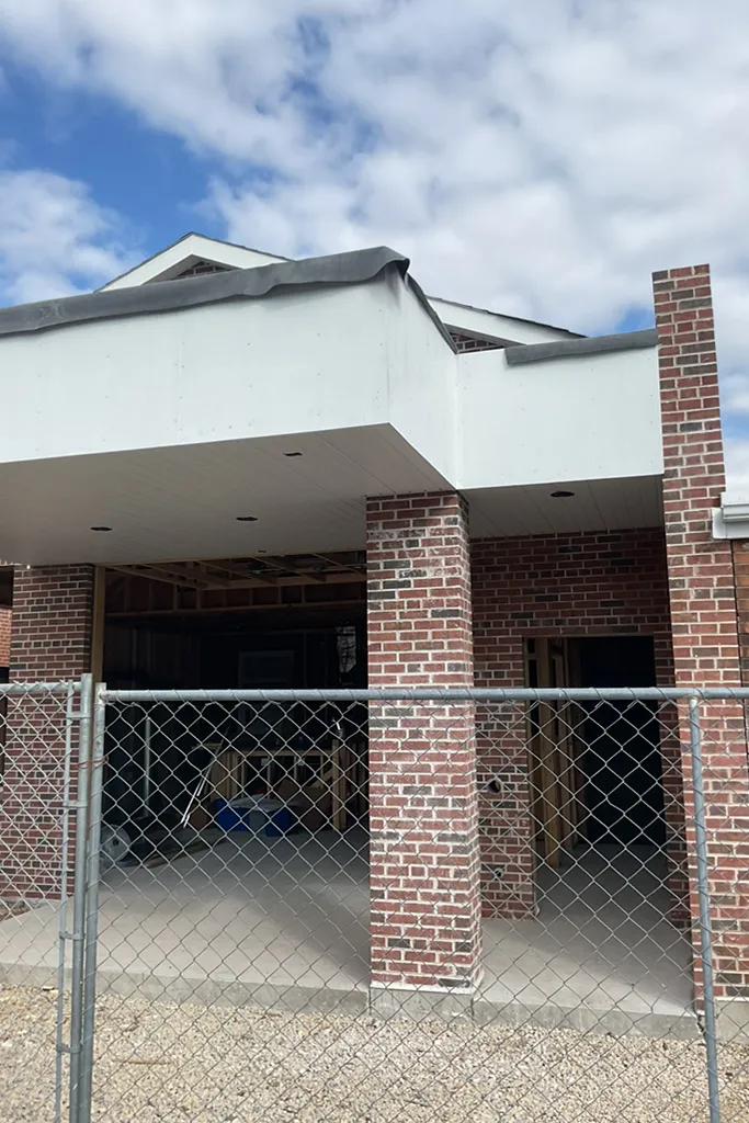 building entrance with brick columns